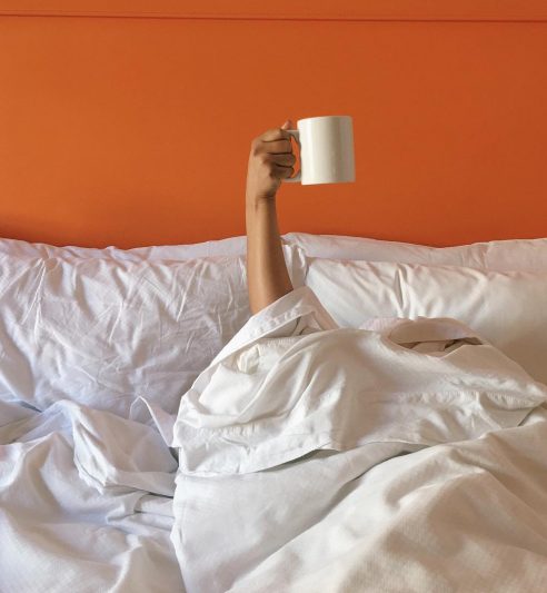 someone raising a cup