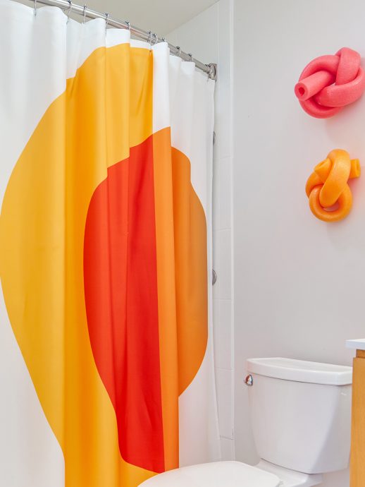 Bathroom with shower and pool noodles